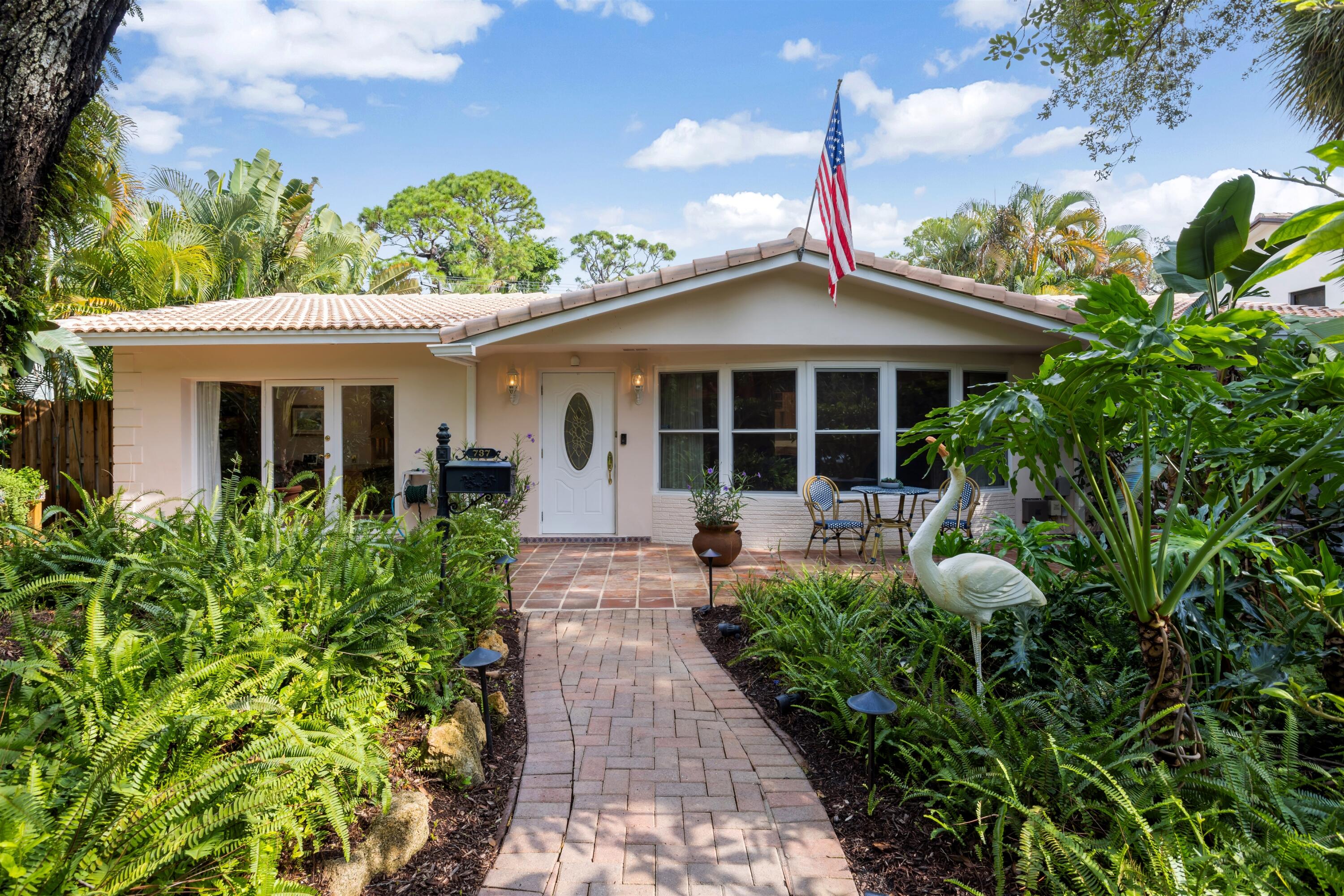 737 Aurelia Street Boca Raton, FL 33486 - Photo 1 of 1 a view of a house with potted plants