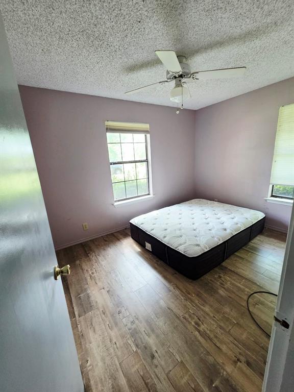 722 South Church Street Pilot Point, TX 76258 - Photo 14 of 37 wooden floor with a window in a room