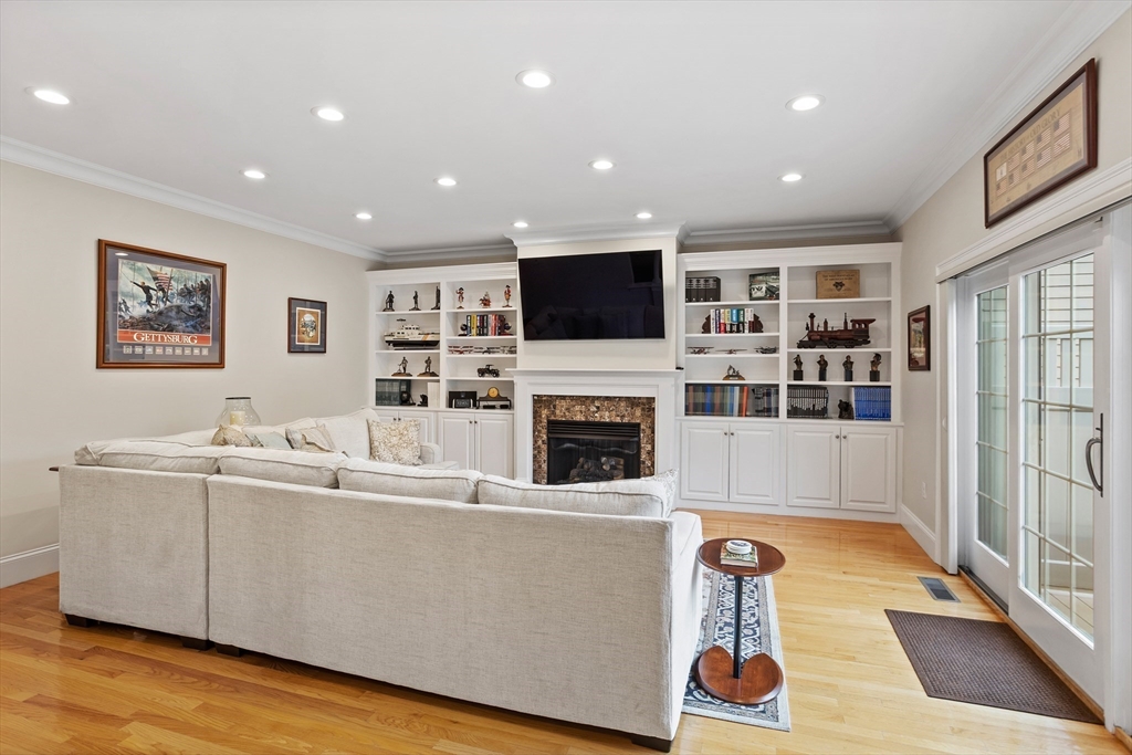 57 Sunset Ridge Lane, Unit 57 Bolton, MA 01740 - Photo 11 of 42 a living room with furniture and a flat screen tv