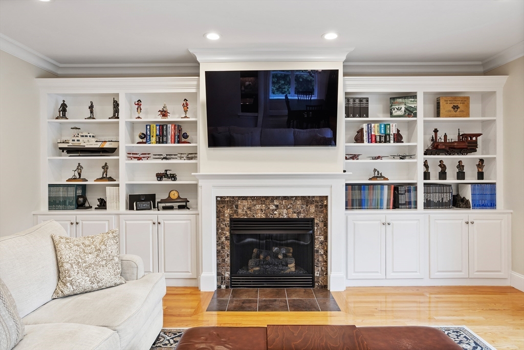 57 Sunset Ridge Lane, Unit 57 Bolton, MA 01740 - Photo 14 of 42 a living room with furniture and a fireplace