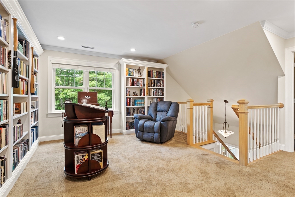 57 Sunset Ridge Lane, Unit 57 Bolton, MA 01740 - Photo 19 of 42 a living room with furniture and a floor to ceiling window