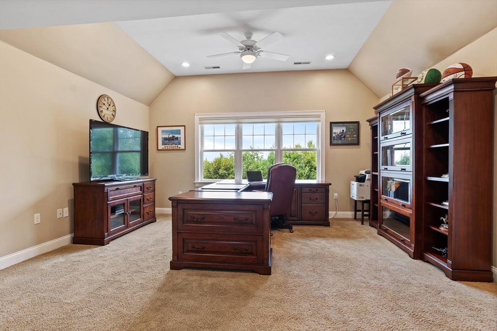 57 Sunset Ridge Lane, Unit 57 Bolton, MA 01740 - Photo 21 of 42 a living room with furniture window and flat screen tv