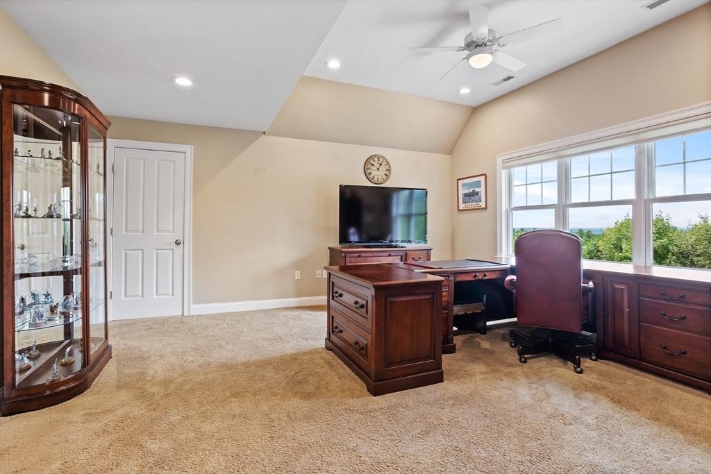 57 Sunset Ridge Lane, Unit 57 Bolton, MA 01740 - Photo 23 of 42 a livingroom with workspace and a window