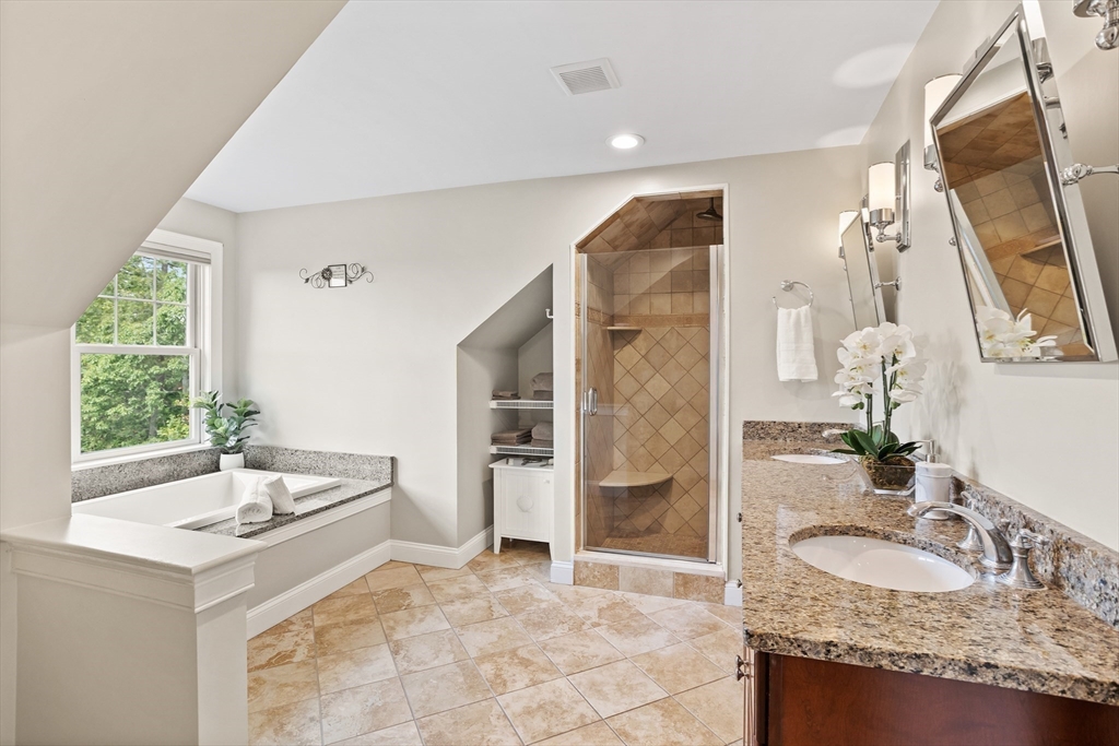 57 Sunset Ridge Lane, Unit 57 Bolton, MA 01740 - Photo 24 of 42 a bathroom with a sink and a mirror