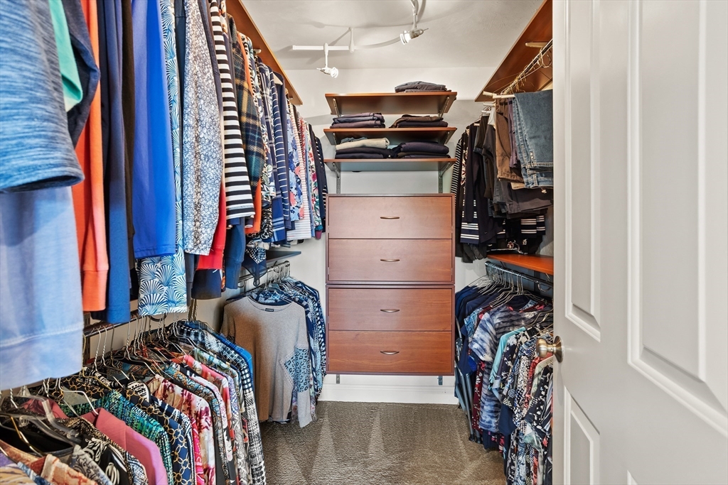 57 Sunset Ridge Lane, Unit 57 Bolton, MA 01740 - Photo 26 of 42 a view of walk in closet with clothes