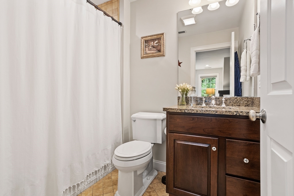 57 Sunset Ridge Lane, Unit 57 Bolton, MA 01740 - Photo 29 of 42 a bathroom with a granite countertop sink and a toilet