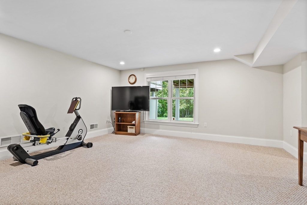 57 Sunset Ridge Lane, Unit 57 Bolton, MA 01740 - Photo 31 of 42 a view of a room with gym equipment