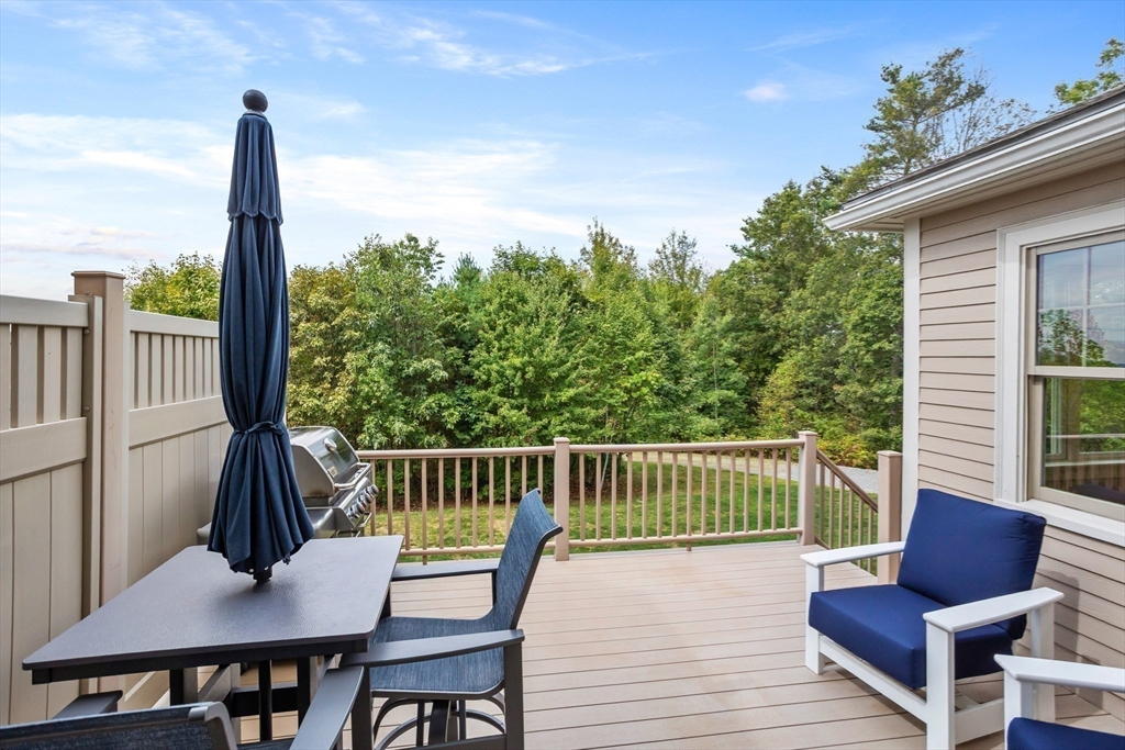 57 Sunset Ridge Lane, Unit 57 Bolton, MA 01740 - Photo 36 of 42 a view of a deck with furniture