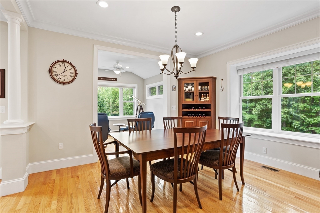 57 Sunset Ridge Lane, Unit 57 Bolton, MA 01740 - Photo 8 of 42 a view of a dining room with furniture window and wooden floor