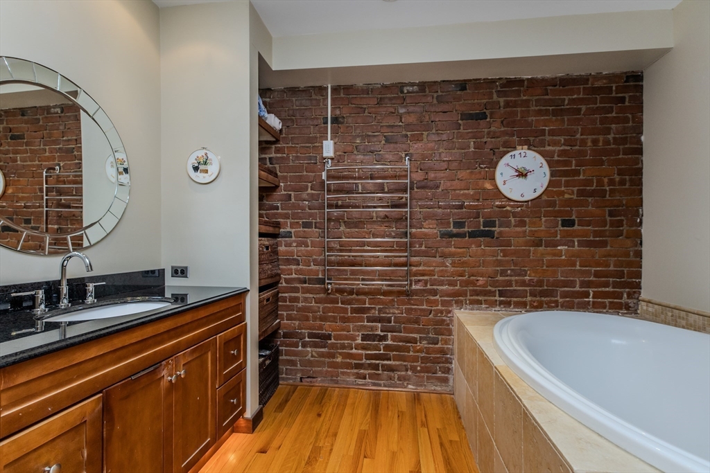 231 Main Street, Unit 3R Northampton, MA 01060 - Photo 15 of 22 a bathroom with a sink and a bathtub