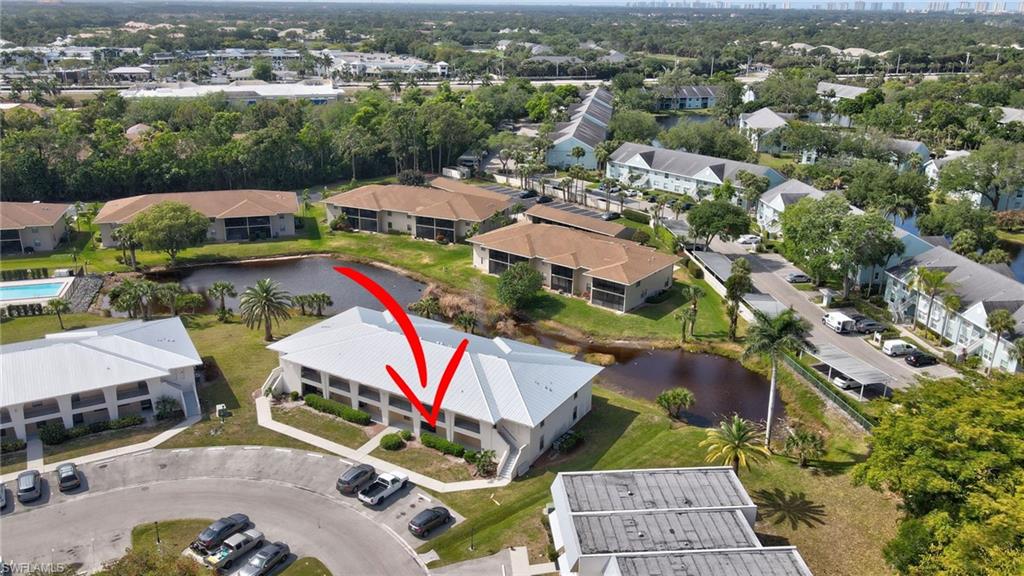 151 Cypress Way East, Unit D3 Naples, FL 34110 - Photo 2 of 46 Birds eye view of property with a water view and a residential view