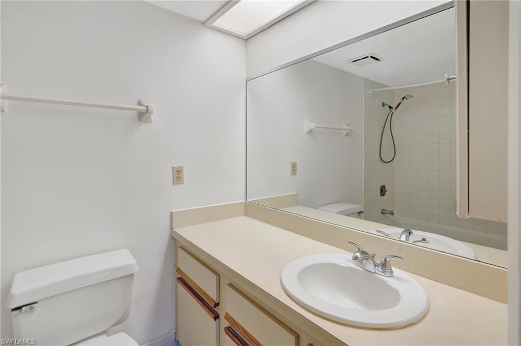 151 Cypress Way East, Unit D3 Naples, FL 34110 - Photo 30 of 46 Bathroom with visible vents, toilet, shower / bathing tub combination, and vanity