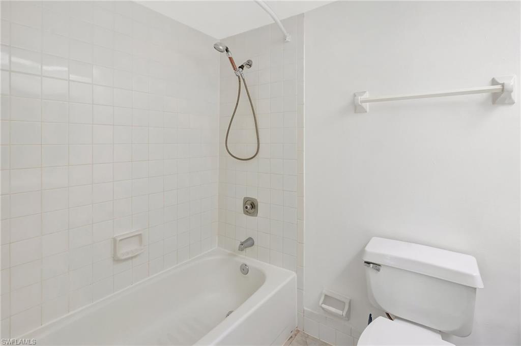 151 Cypress Way East, Unit D3 Naples, FL 34110 - Photo 31 of 46 Bathroom with toilet and shower / tub combination