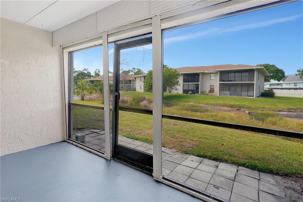 151 Cypress Way East, Unit D3 Naples, FL 34110 - Photo 36 of 46 View of unfurnished sunroom