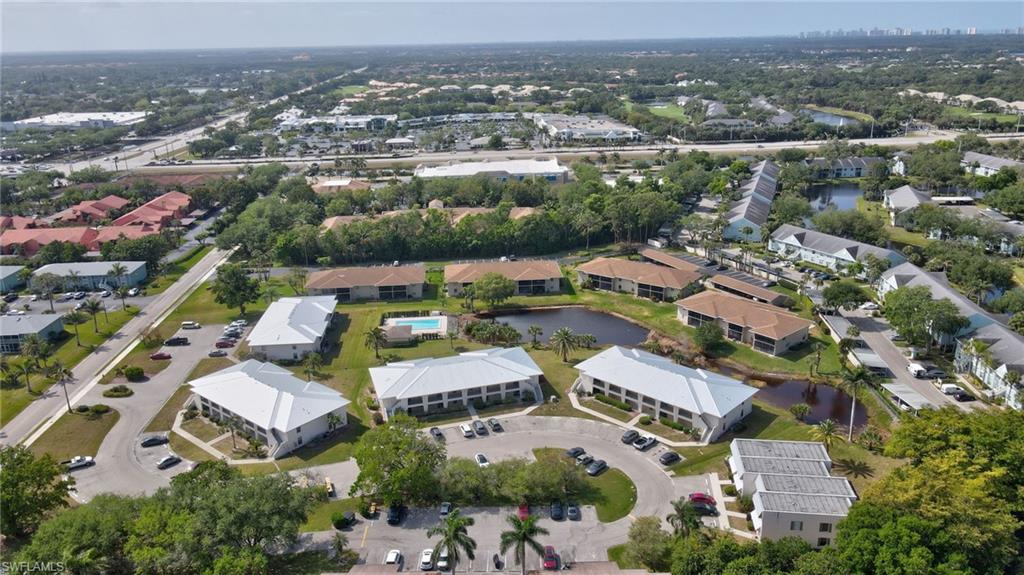 151 Cypress Way East, Unit D3 Naples, FL 34110 - Photo 43 of 46 Aerial view with a residential view and a water view