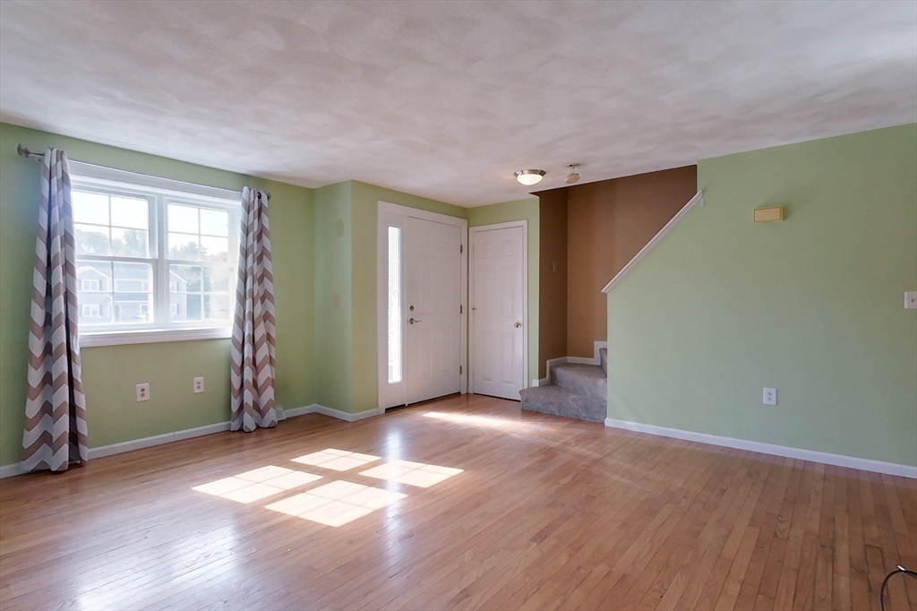 34 Lowell Road, Unit 12 Pepperell, MA 01463 - Photo 12 of 31 an empty room with windows and closet