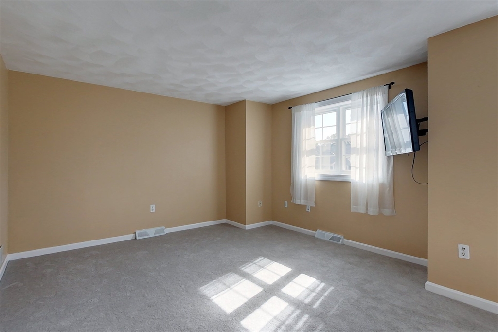 34 Lowell Road, Unit 12 Pepperell, MA 01463 - Photo 15 of 31 an empty room with windows