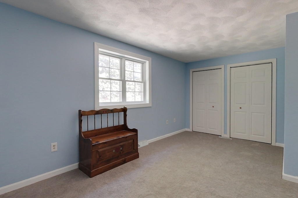 34 Lowell Road, Unit 12 Pepperell, MA 01463 - Photo 17 of 31 an empty room with windows