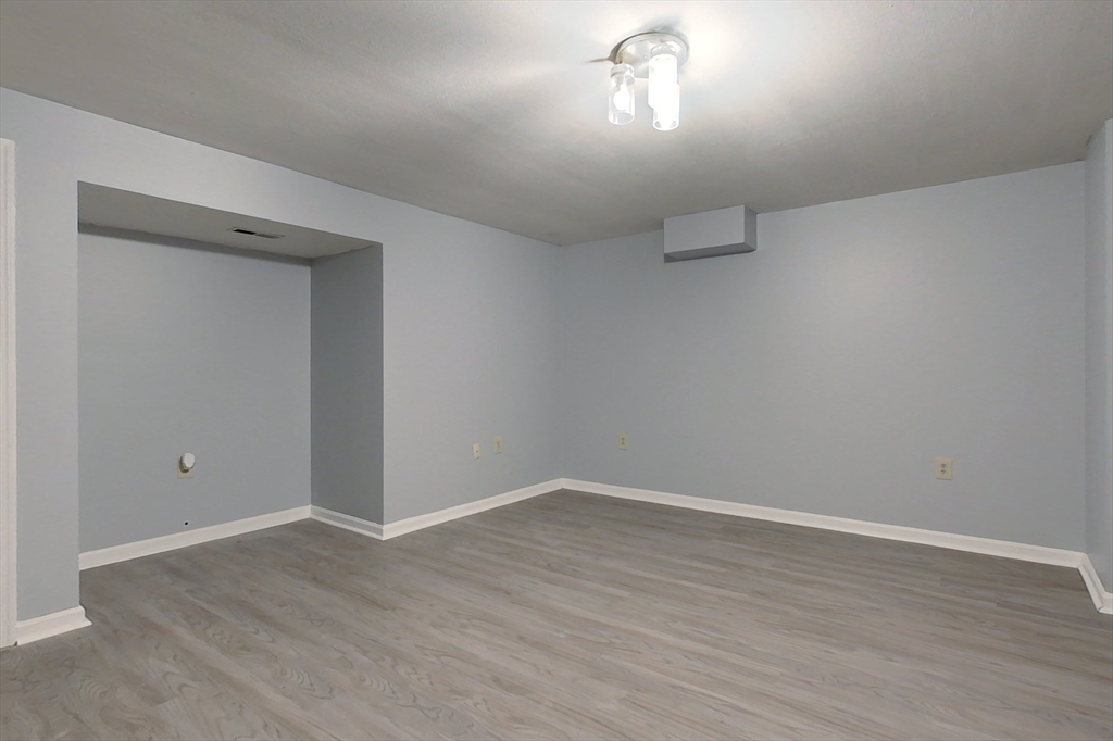 34 Lowell Road, Unit 12 Pepperell, MA 01463 - Photo 20 of 31 wooden floor in an empty room