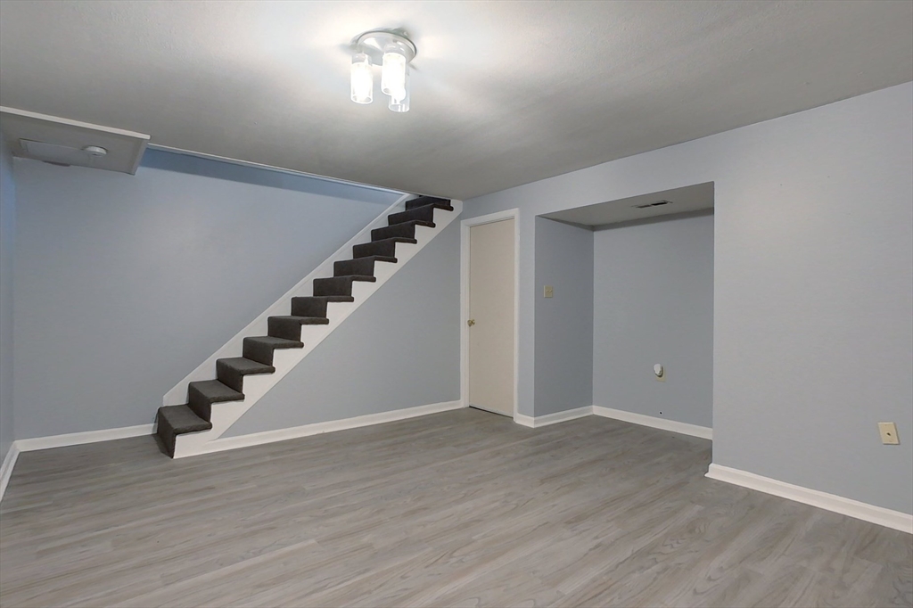 34 Lowell Road, Unit 12 Pepperell, MA 01463 - Photo 22 of 31 a view of an entryway with wooden floor