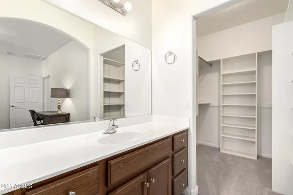 a bathroom with a sink double vanity and a mirror