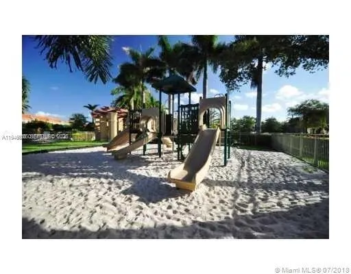 a front view of a house with plants