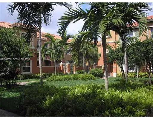 a view of a palm trees in front of a house