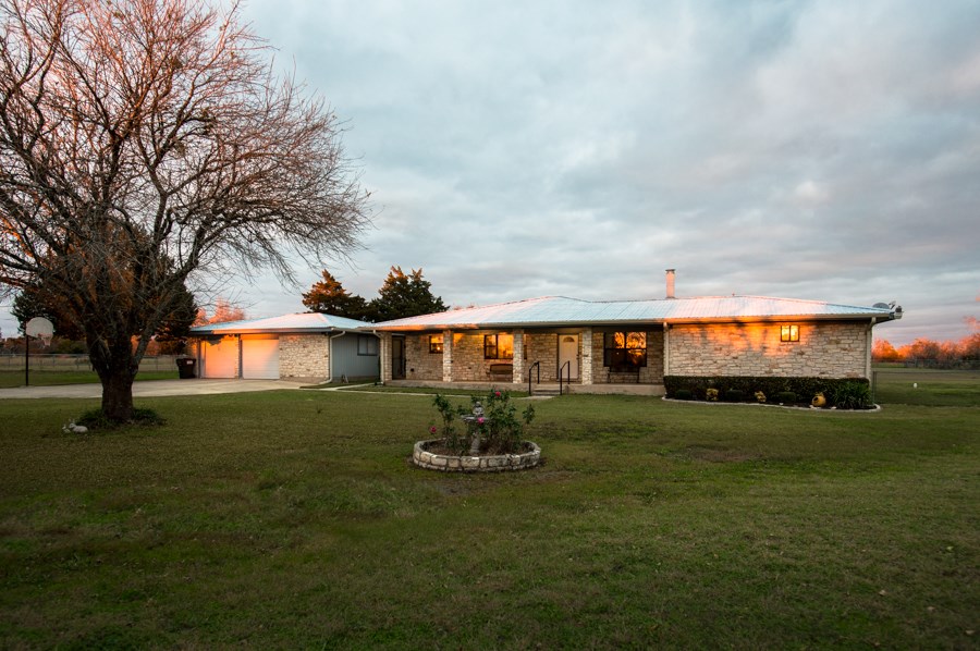 10911 Parsons Road Manor, TX 78653 - Photo 1 of 1 a view of a big yard with a large tree