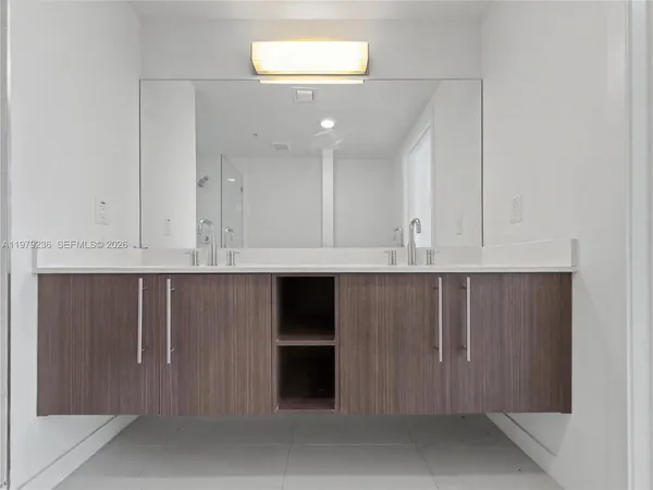 a view of kitchen with cabinets