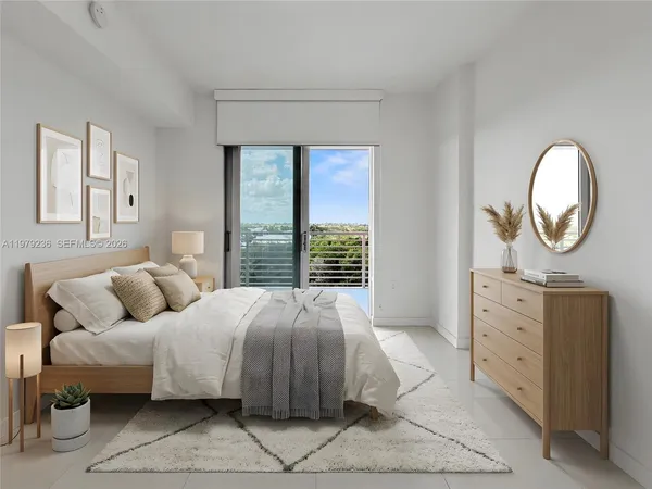 a bedroom with a bed and a dresser