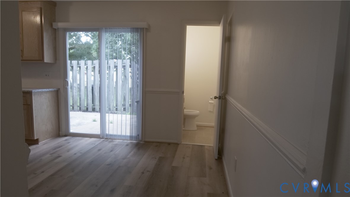 419 Roxana Road Henrico, VA 23075 - Photo 53 of 56 a view of an empty room with wooden floor and a window