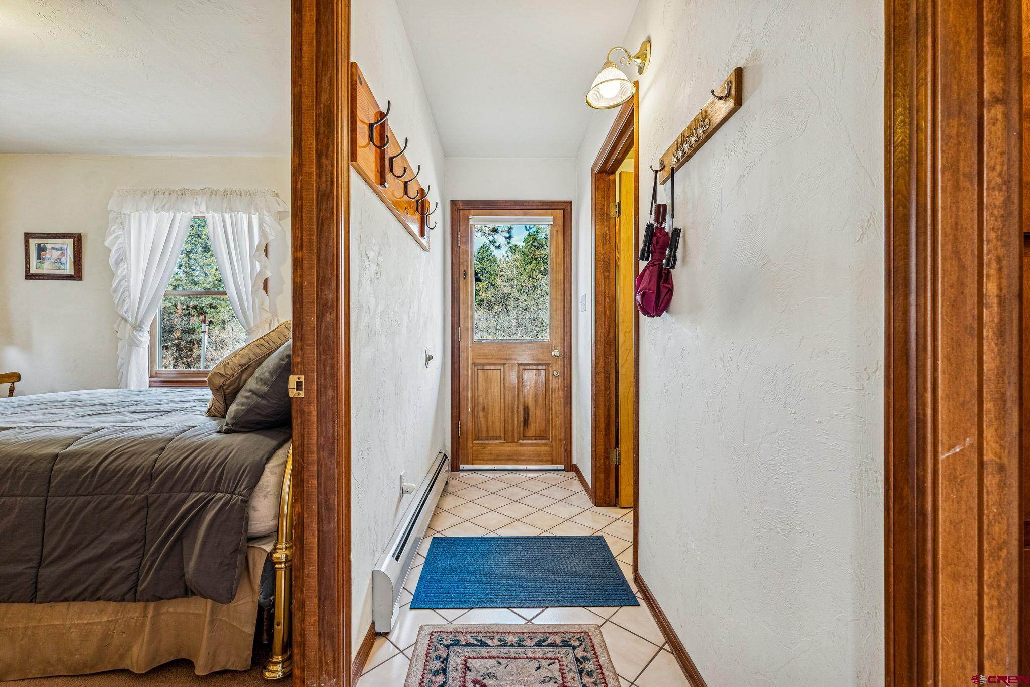 145 Cliffside Drive Durango, CO 81301 - Photo 11 of 43 a bedroom with a bed and a window
