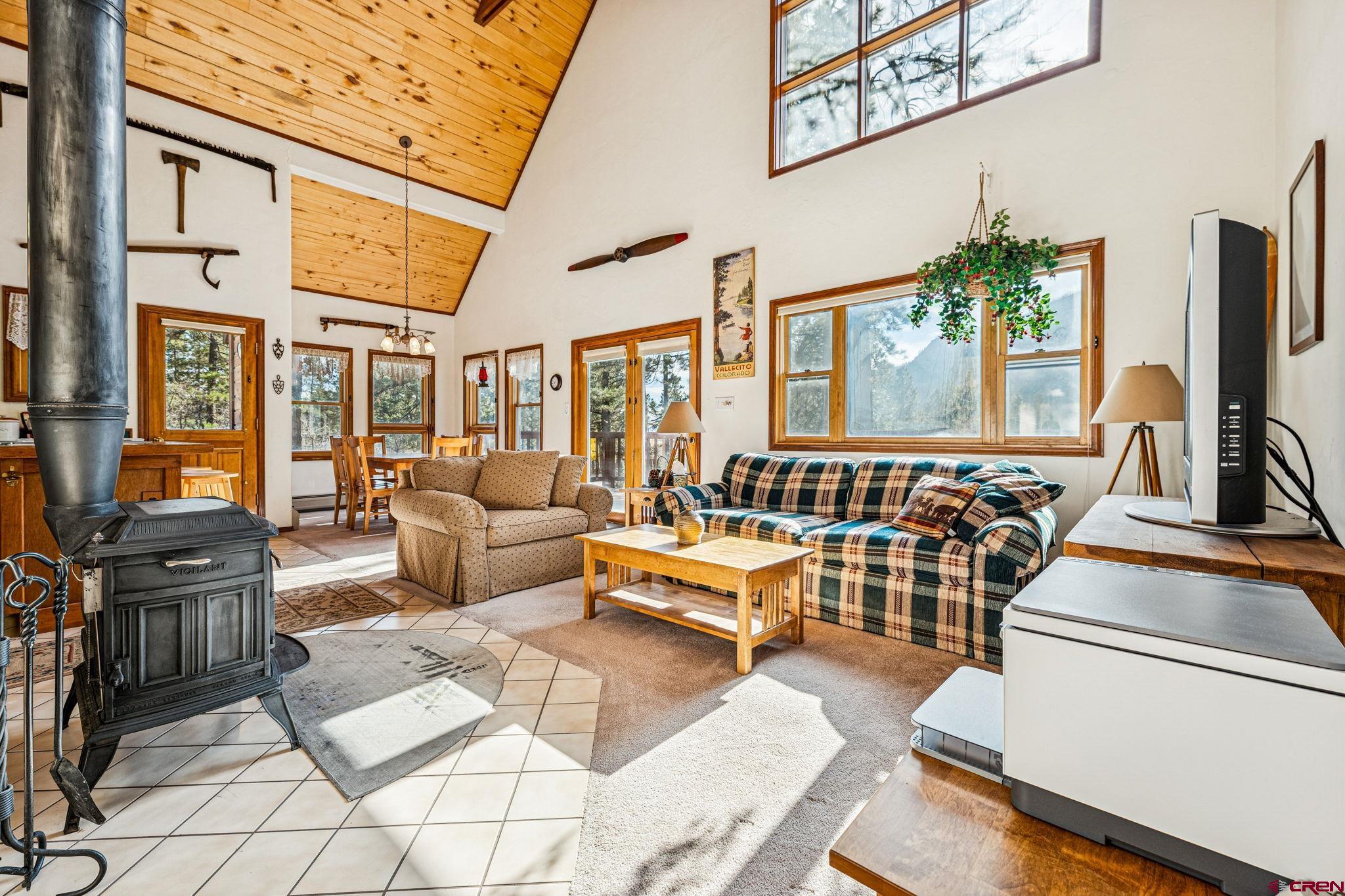 145 Cliffside Drive Durango, CO 81301 - Photo 22 of 43 a living room with furniture and a flat screen tv