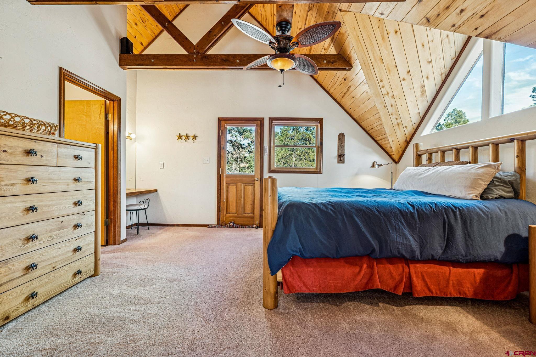 145 Cliffside Drive Durango, CO 81301 - Photo 27 of 43 a bedroom with a bed and a window