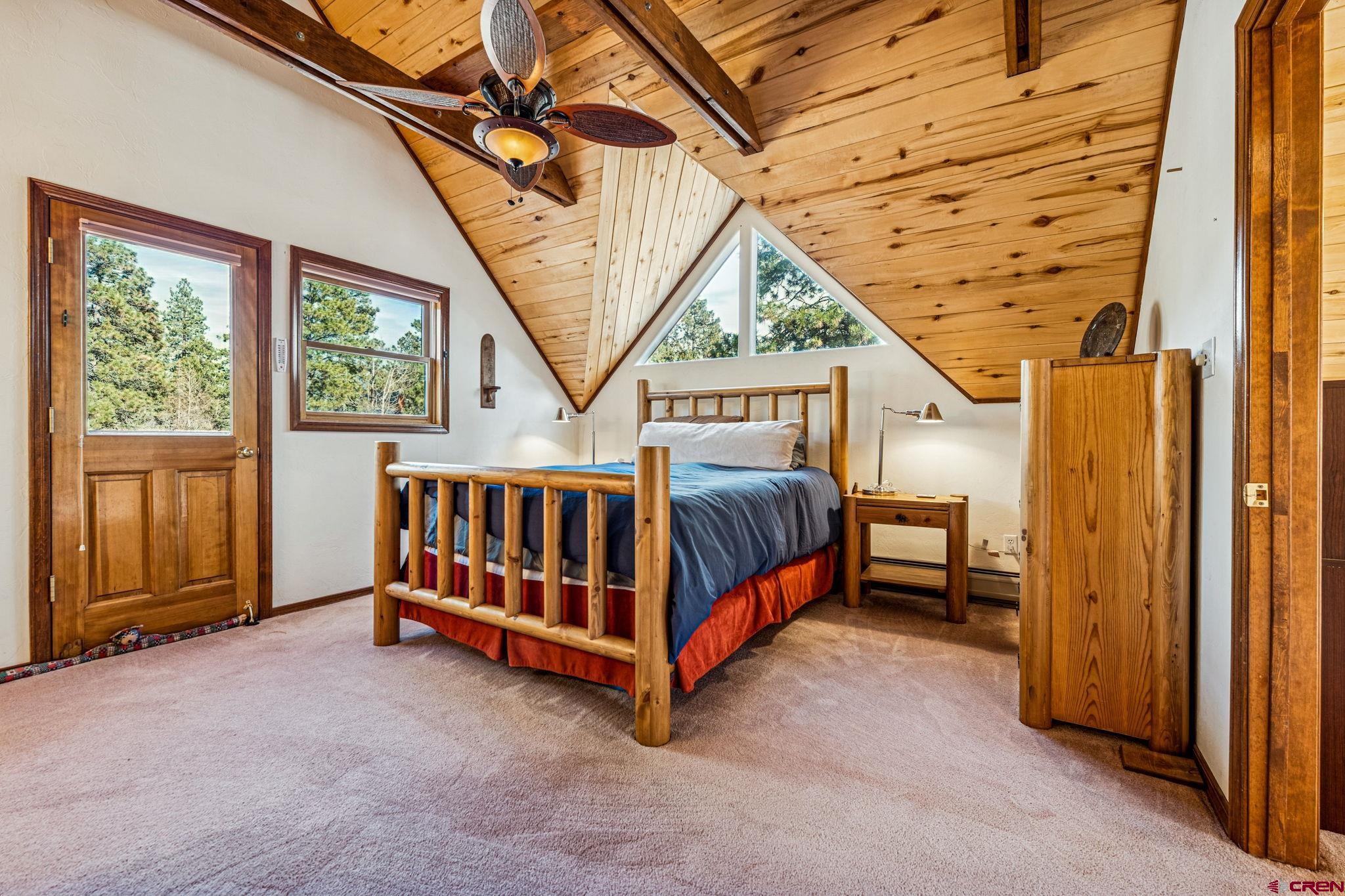 145 Cliffside Drive Durango, CO 81301 - Photo 28 of 43 a bedroom with a bed and a window