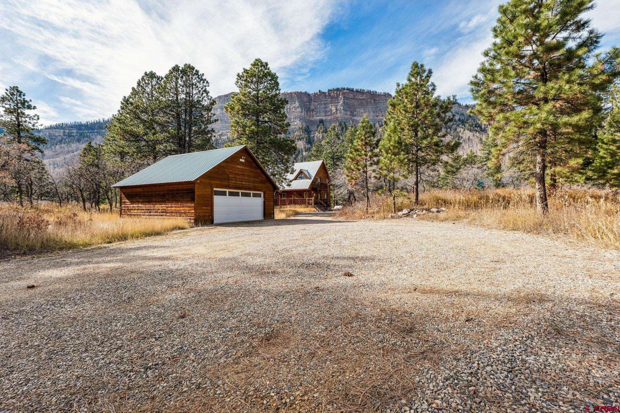 145 Cliffside Drive Durango, CO 81301 - Photo 3 of 43 a view of a house with a yard