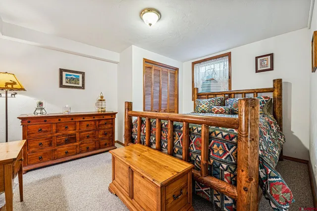 a balcony with wooden floor and outdoor space