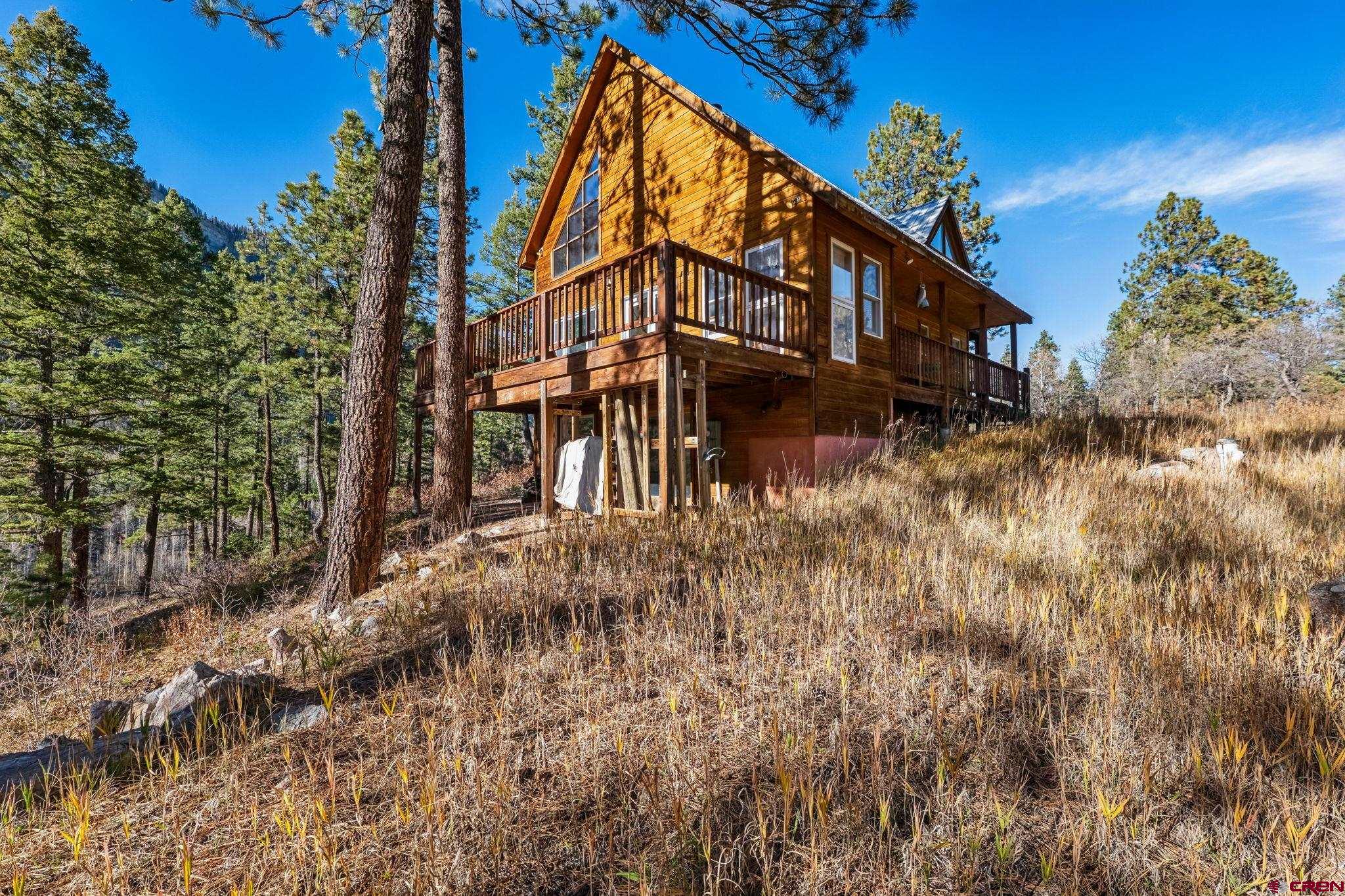 145 Cliffside Drive Durango, CO 81301 - Photo 4 of 43 a view of a house with a yard