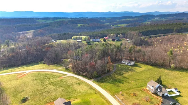 a view of a swimming pool with a table and chairs