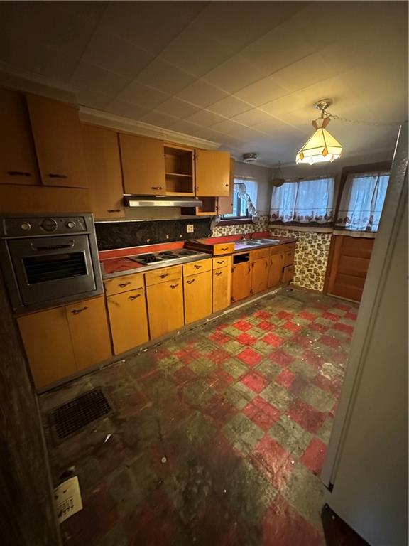 466 Broad Street Washington, PA 15301 - Photo 4 of 11 a large kitchen with stainless steel appliances wooden cabinets and a counter top space
