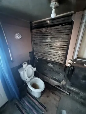 a bathroom with a toilet and a sink