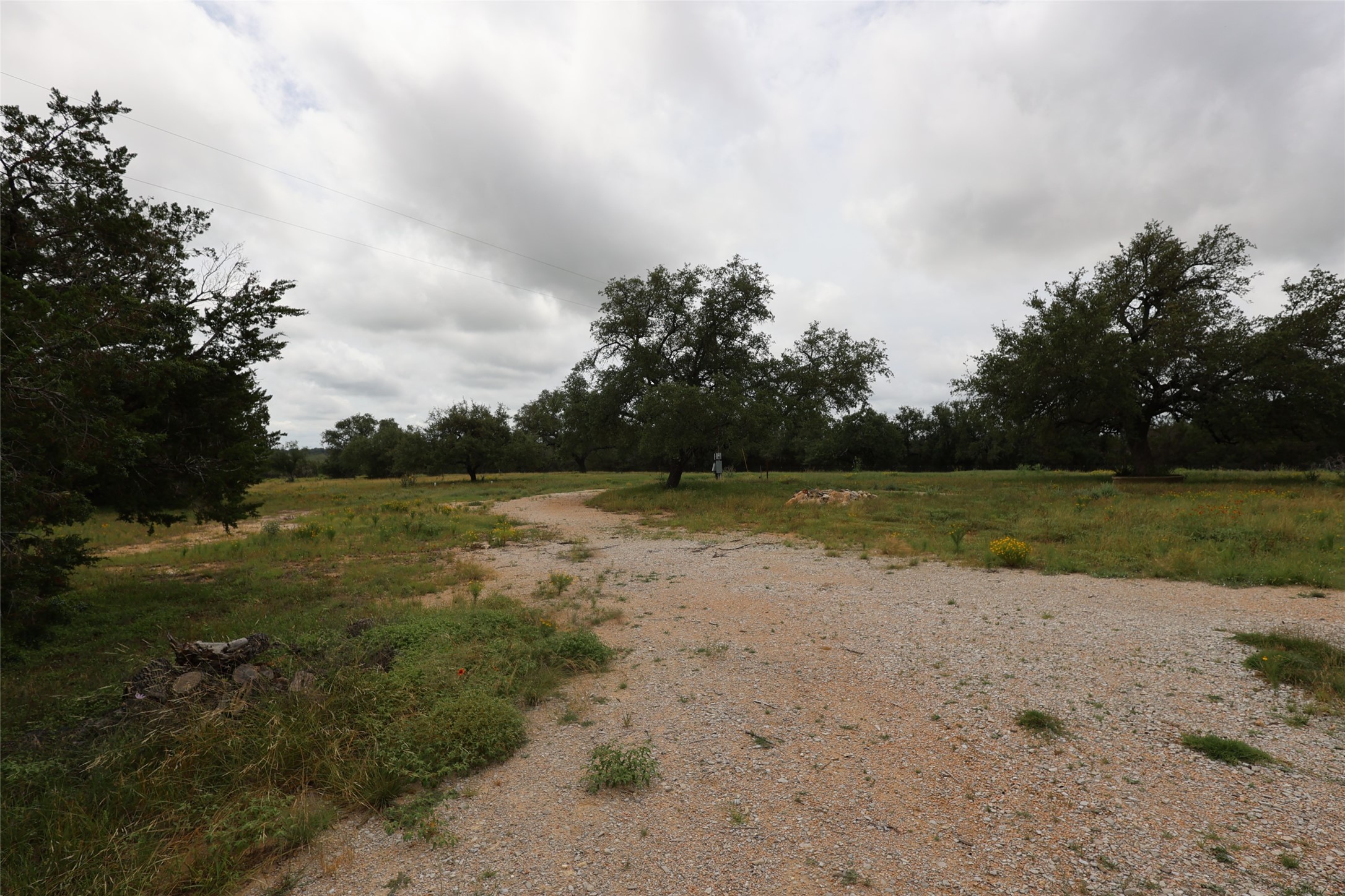 1399 Klett Ranch Road Johnson City, TX 78636 - Photo 13 of 23 a view of a lake with a big yard