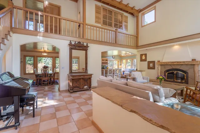 a living room with fireplace furniture and a fireplace