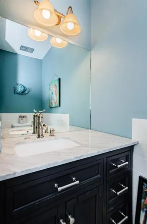 a room with a sink cabinets and wooden floor