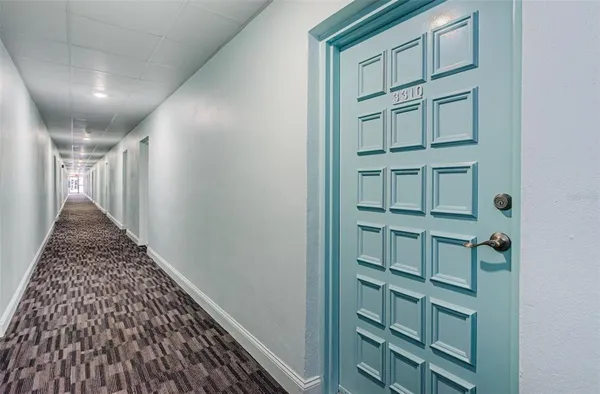 a view of a hallway with staircase