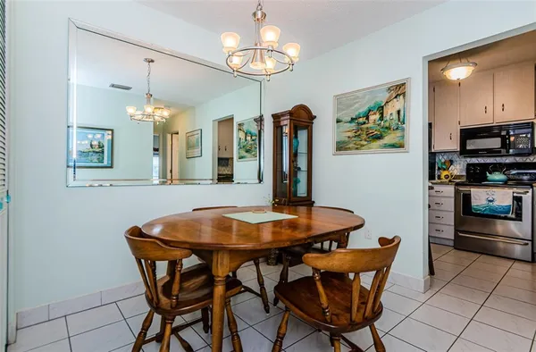 a dining room with furniture and window