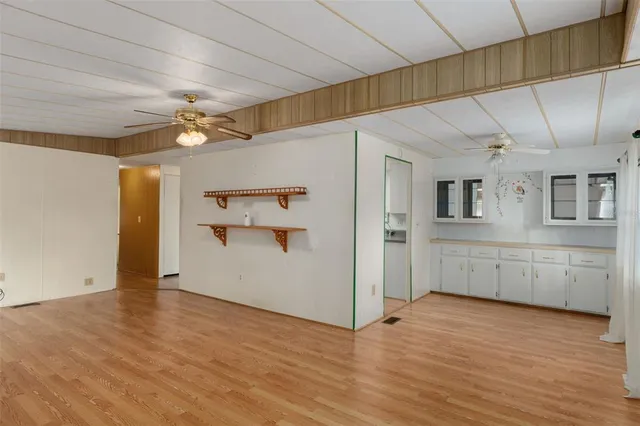 a view of a kitchen with wooden floor