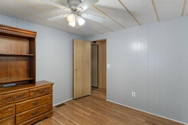 a view of room with wooden floor
