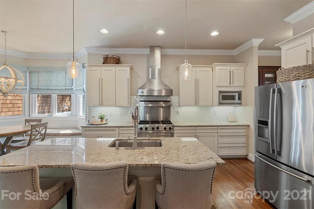 851 Stratford Run Drive Fort Mill, SC 29708 - Photo 13 of 48 a kitchen with stainless steel appliances granite countertop a sink a stove and a refrigerator