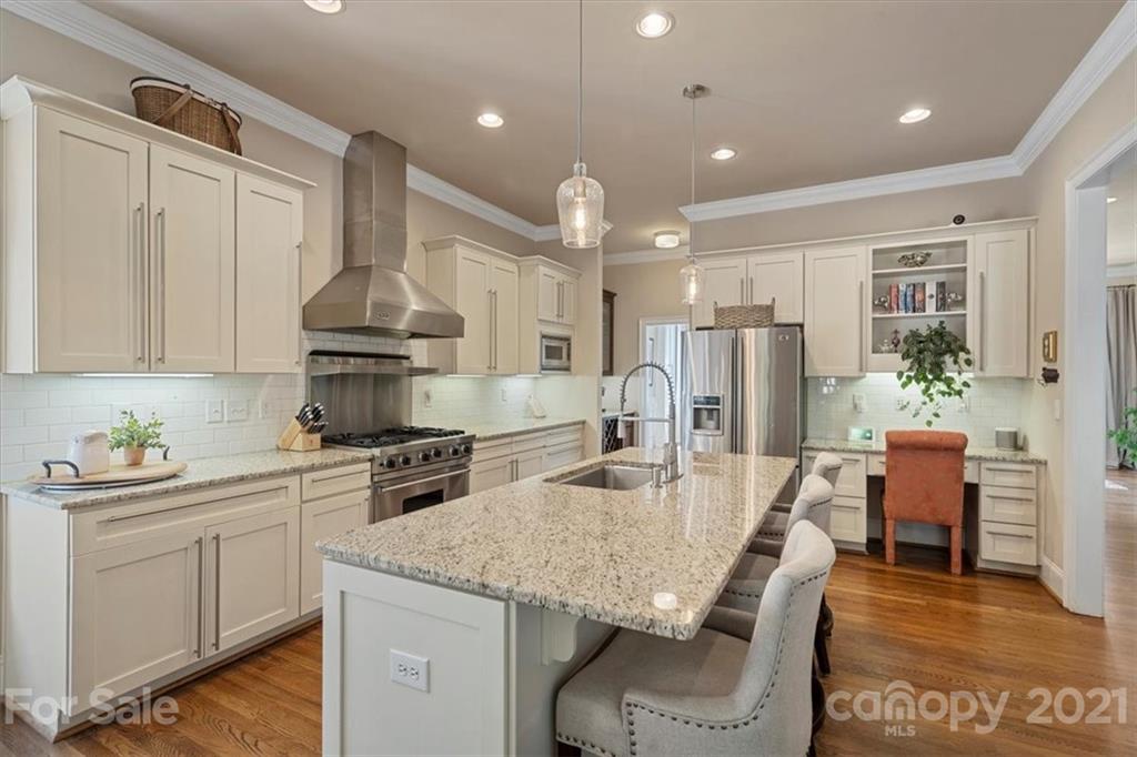 851 Stratford Run Drive Fort Mill, SC 29708 - Photo 15 of 48 a kitchen with stainless steel appliances granite countertop a stove refrigerator and cabinets
